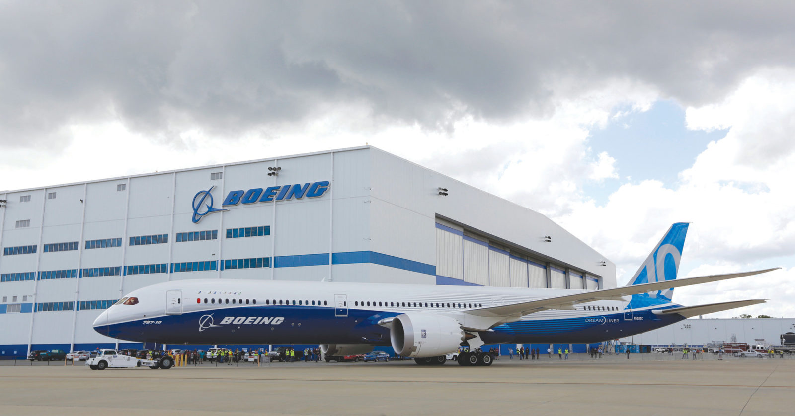 FILE - In this March 31, 2017, file photo, Boeing employees stand near the new Boeing 787-10 Dreamliner at the company's facility in South Carolina after conducting its first test flight at Charleston International Airport in North Charleston, S.C. The United States' top labor official made a stop Friday at Boeing's South Carolina facilities, highlighting a new Trump administration commitment to workforce development. On Thursday, July 19, 2018, President Donald Trump signed an executive order asking companies to pledge to invest in work-based education and training like apprenticeships. (AP Photo/Mic Smith, File)