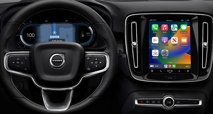 Volvo XC40 Recharge - Navigation on driver display with Apple CarPlay home page on centre display